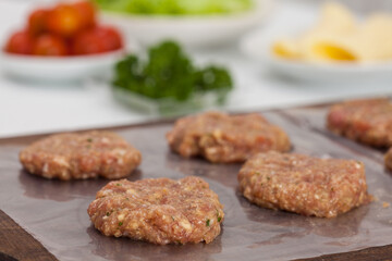 Step by step preparation of mini burgers. Homemade mini burgers for children or appetizers. Small hamburgers.