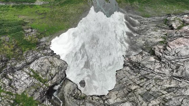 Only small patch of snow is left below Boyabreen glacier in Fjaerland Norway - Melted glacier leftowers in birdseye perspective - 60FPS Norway