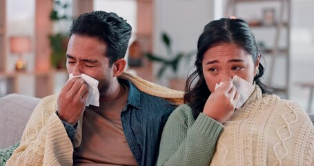 Couple, sick and virus with tissue, blowing nose and sinus infection with allergies and people on sofa at home. Cold, flu and relationship, fatigue and recovery, man and woman with illness together - Powered by Adobe