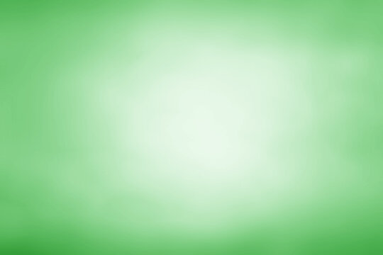Green background with light in the center abstract gradient