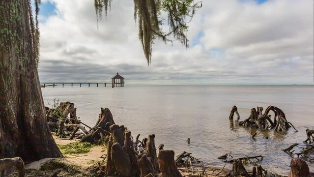 Distant View Of Beach Pier At Fontainebleau State Park In Mandeville, Louisiana, USA. wide, timelapse