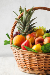 Basket with ripe exotic fruits. Harvesting.