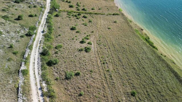 Wild and beautiful coastal area in Zadar region from above. Sandy blue bay in Zadar region.