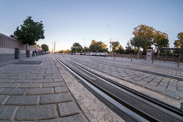 Public transport Concept. Copy space. Ultra wide angle photo of tram tracks. Konya city, Turkey.