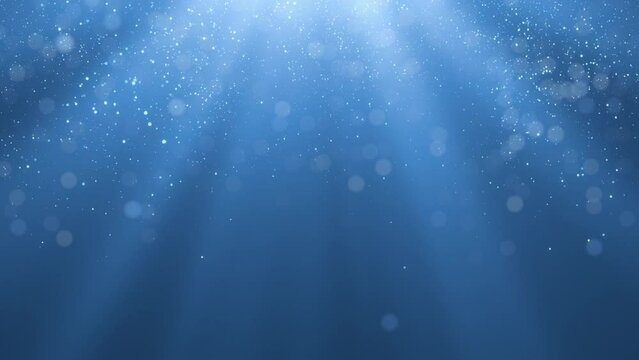 Blue abstract background with shining particles blue color and glitter sparkle