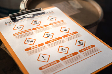 A balloint pen is placed on hazardouse chemical checking icon sysmbol, that using for correct the...