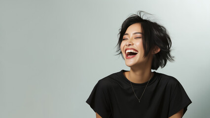 Cheerful asian positive girl wearing activewear, laughing out loud