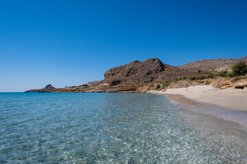 Crete, the shallow water of long beautiful sandy beach Mazida i Ammos. Xerocampos village. Lasithi Province, Greece 
