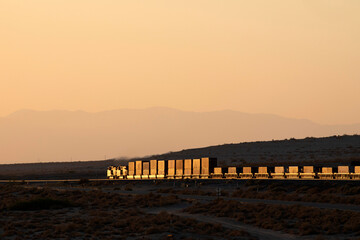A train going away from viewer at dusk