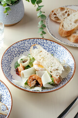 caesar salad with shrimp. restaurant menu.