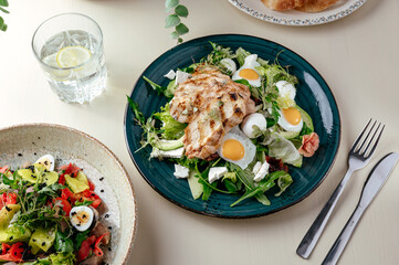 warm salad with grilled chicken and egg . restaurant menu
