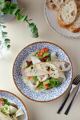 caesar salad with salmon. restaurant menu.