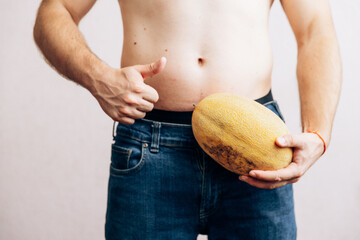 The guy is holding a banana in his jeans. Men's health prostate prevention