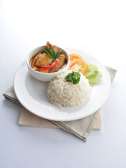 signature Malay nonya spicy chilli curry leaf chicken and potato with steamed jasmine white rice and vegetable salad in plate on white background asian halal food cuisine menu for cafe design