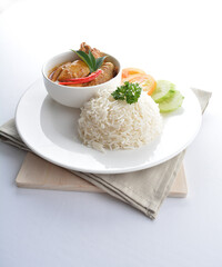 signature Malay nonya spicy chilli curry leaf chicken and potato with steamed jasmine white rice and vegetable salad in plate on white background asian halal food cuisine menu for cafe design