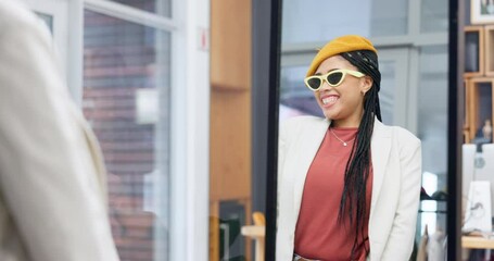 Retail, shopping and sunglasses of a woman at shop mirror with confidence. Female person, smile and happy from deal purchase in a boutique store with fashion, stylish and trendy eyewear choice