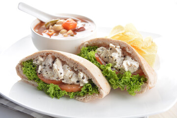 chicken tuna salad kebab open pocket bread with tomato abc soup and crispy potato chips combo healthy set in plate on white background asian halal food cuisine vegan menu for cafe design