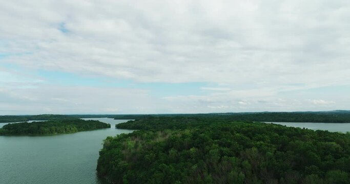 Lush Green Forest On The Islands In Percy Priest Lake With Cloudy Sky In Tennessee, USA.