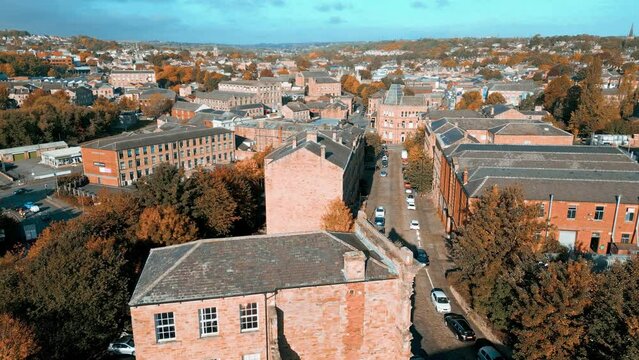 Aerial drone footage of the English market town centre of Dewsbury in West Yorkshire in the UK showing the historical town centre and the Dewsbury townhall.