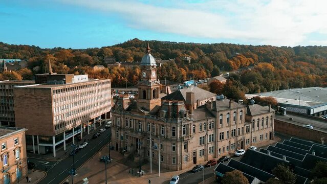 Aerial drone footage of the English market town centre of Dewsbury in West Yorkshire in the UK showing the historical town centre and the Dewsbury townhall.