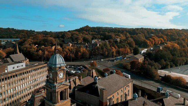 Aerial drone footage of the English market town centre of Dewsbury in West Yorkshire in the UK showing the historical town centre and the Dewsbury townhall.