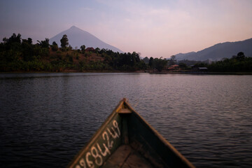 Sunrise over lake with volcano in the background in Ruanda, Africa