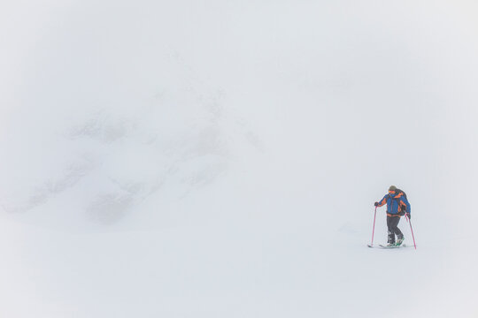 Man ski touring in white out conditions, poor visibility