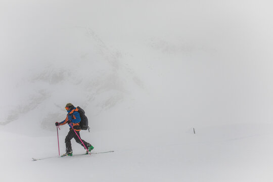 Man ski touring in white out conditions, poor visibility