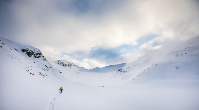 Landscape view of skier touring on snow covered glacier