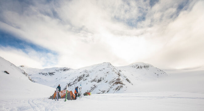 Skiers at basecamp after a day of backcountry skiing, exploring