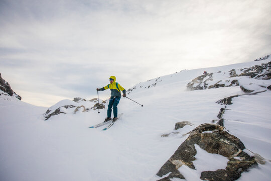 Skier keeps his balance while racing downhill