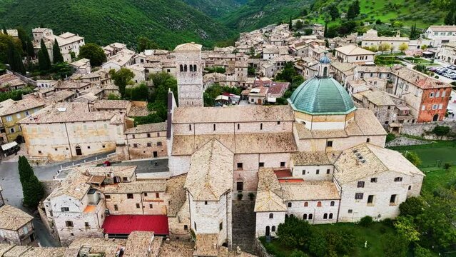 Cathedral of San Rufino of Assisi With Blue Dome Within The Town And Comune Of Assisi In Italy. - aerial