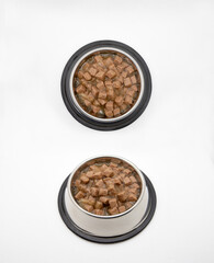 Pet bowls with feed on white background. Wet feed. Collage. Pet bowls with feed.
