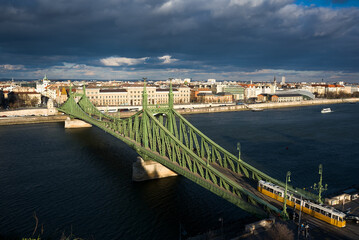 Fototapeta premium Budapest view featuring Liberty bridge and tram