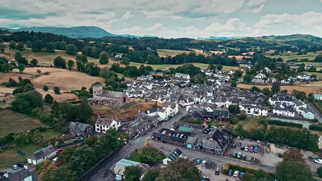 Cinematic aerial drone footage of Hawkshead Village and St Michael and All Angels Church.Cumbria UK.