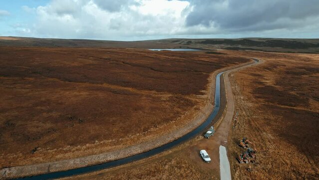 Aerial drone, cinematic footage of a country winding road on Saddleworth Moor, Greater Manchester, UK