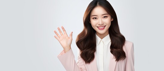 Beautiful young Asian woman holding copy space for advertisement smiling and inviting to go shopping
