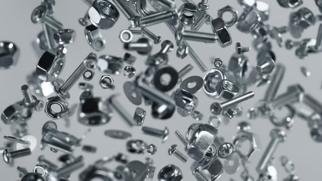 Super Slow Motion Shot of Fasteners Explosion Towards Camera on White Background at 1000fps.