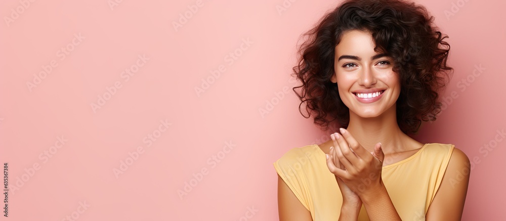 Poster smiling happy woman indicates idea with hand in open space