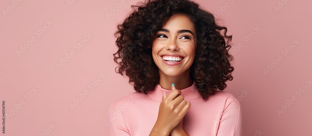 Poster smiling happy woman indicates idea with hand in open space