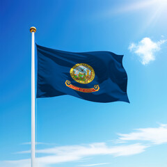 Waving flag of Idaho is a state of United States on flagpole