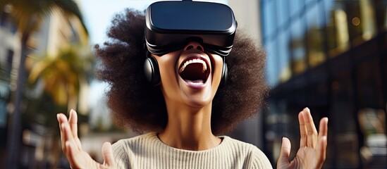 Happy African American woman in a dress using VR glasses and controlling space with her hands enjoys game and explores city Online app gadget virtual real