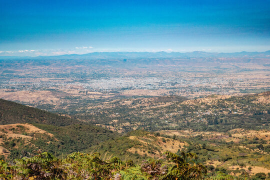 Scenic view of a valley against sky at Mbeya Peak, Tanzania