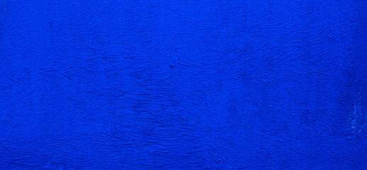 Dark blue concrete wall surface. Old cement background. Copy space for design.	