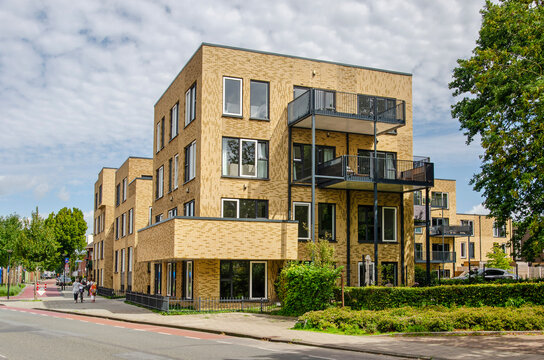 Enschede, The Netherlands, August 9, 2023: modern apartment building with decorative yellow brick facdes in Roombeek neighbourhood