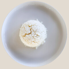 Rice in a white plate arranged in a round shape.