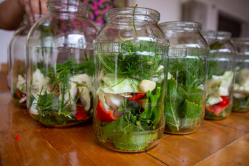 A simple and quick way to pickle tomatoes for the winter: interesting recipes for preparing canned tomatoes cucumber, blackcurrant leaves, cherries, a sprig of parsley and dill; wash thoroughly and dr