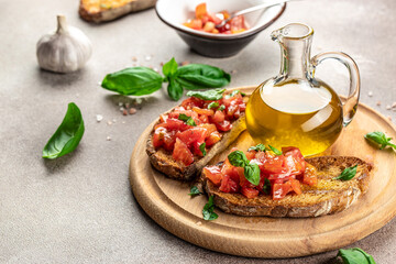 Bruschetta with tomatoes, basil, garlic and olive oil, Delicious breakfast or snack, Clean eating, dieting, vegan food concept. top view