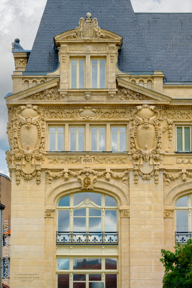 Wall mural detail of the facade of the galeries de jaude, an old department store located on the place de jaude