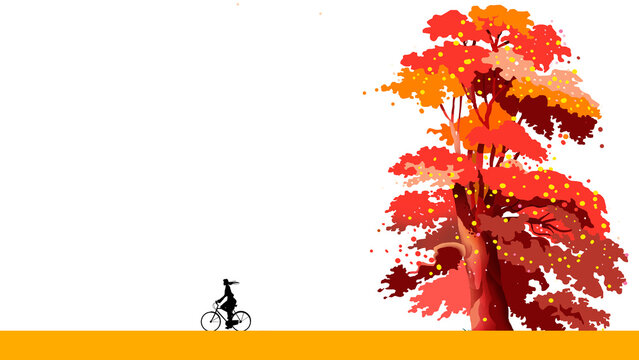 自転車にで走る女性と色づく秋の風景